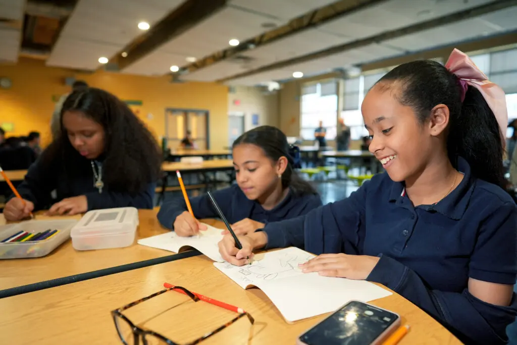 Juniata Park Academy students participate in an interactive drawing workshop led by ‘Dog Man’ Head of Story Anthony Zierhut and Story Artist Jeremy Bernstein.