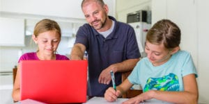 children and man working together