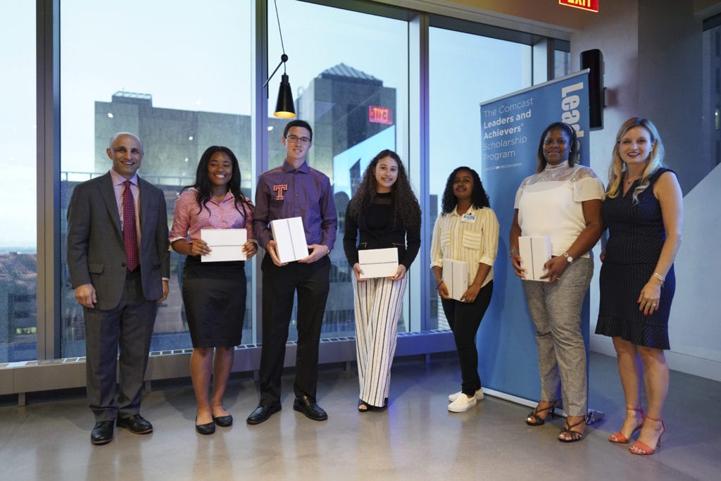 Group of people posing with awards