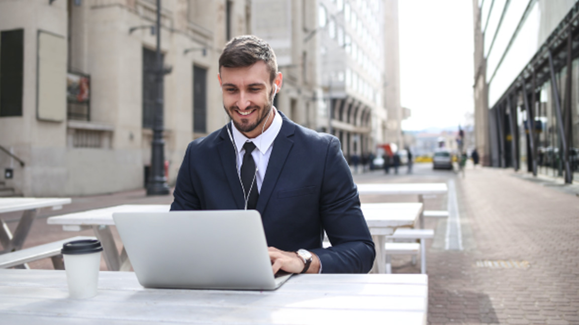 A business owner uses a laptop to do work