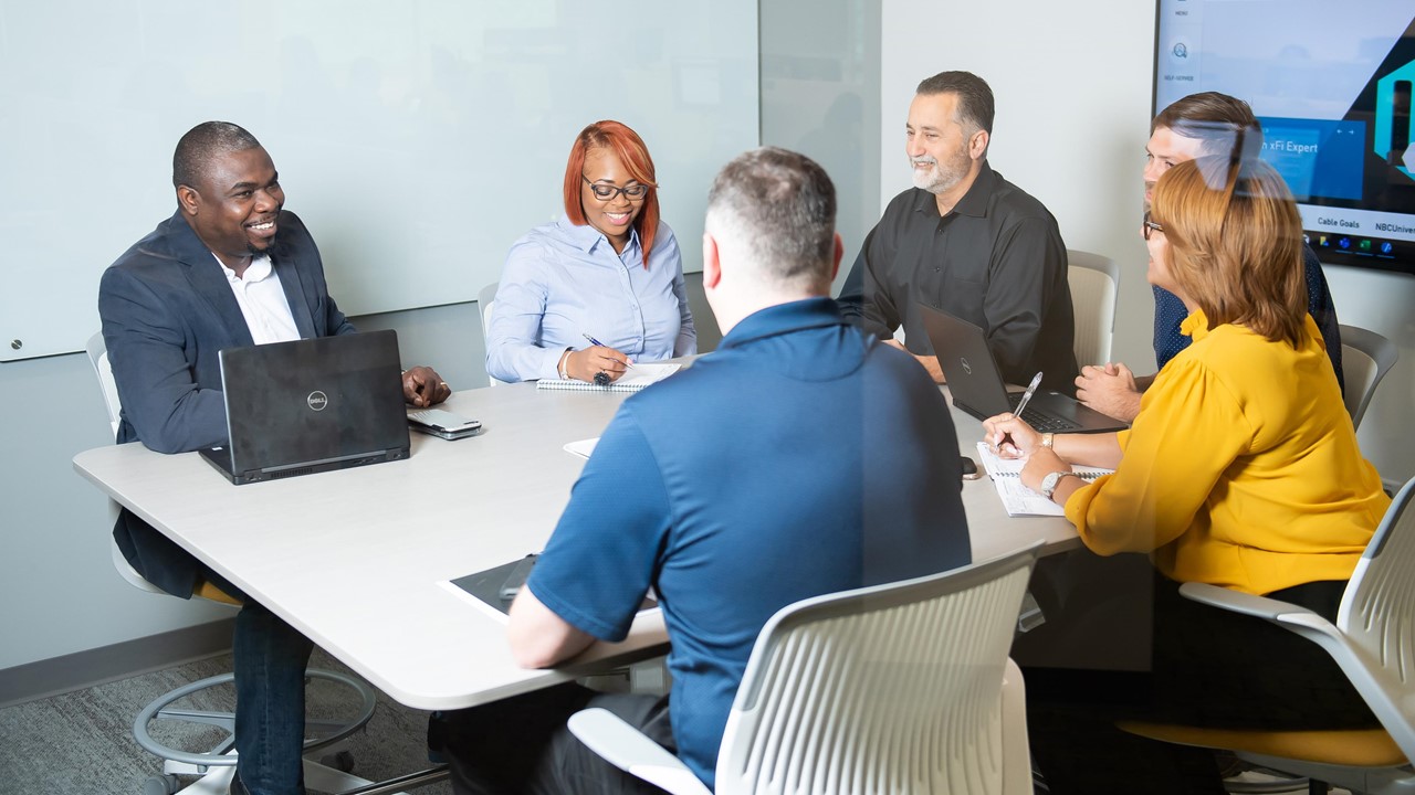 Colleagues meet around a table