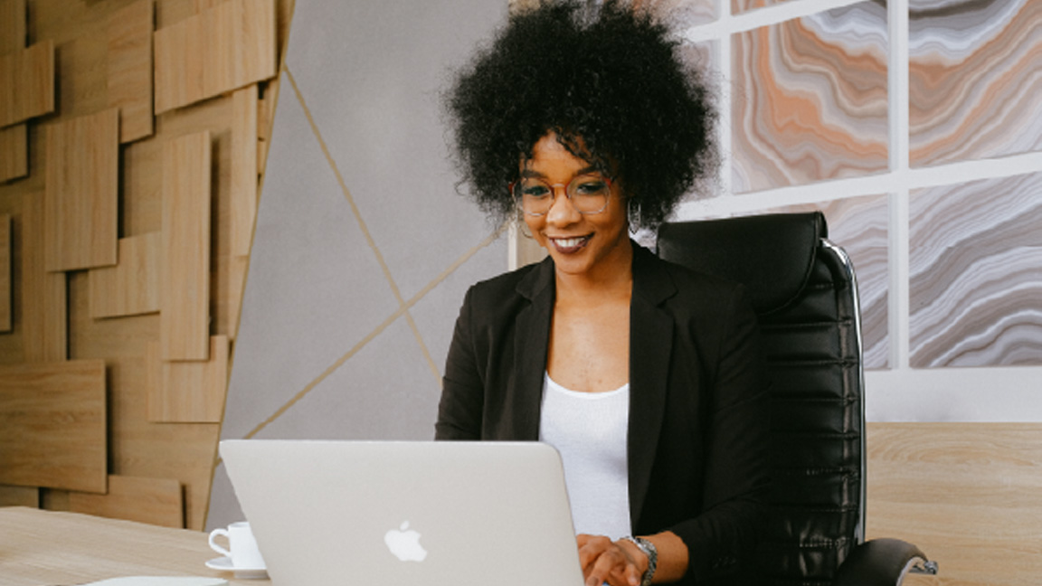 A business owner uses a laptop to do work