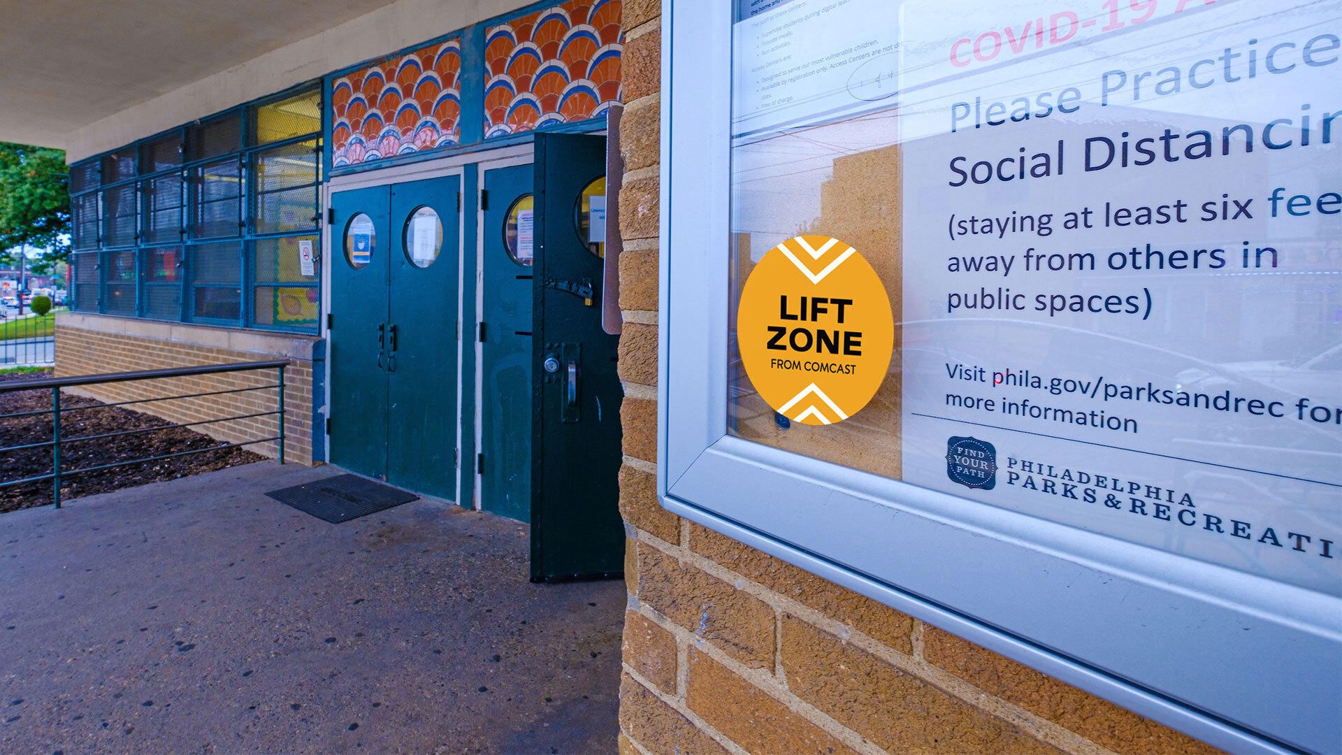 A Lift Zones sticker on a bulletin board.