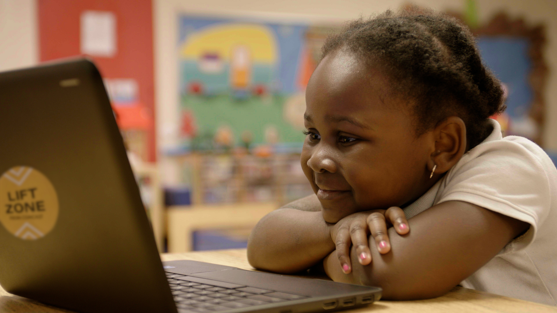 Young student works on a laptop at a Vineland, New Jersey Lift Zone location