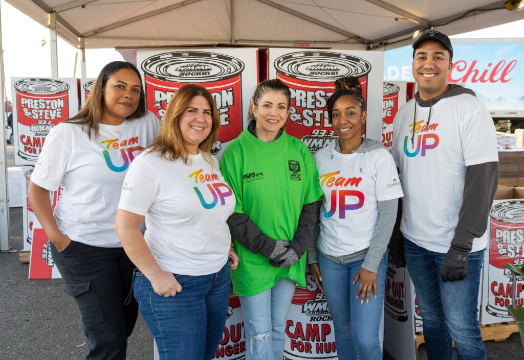 Comcast volunteers wearing Team UP shirts