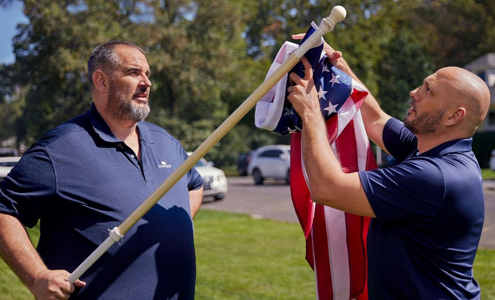 Jeff Tontarski replacing an American Flag