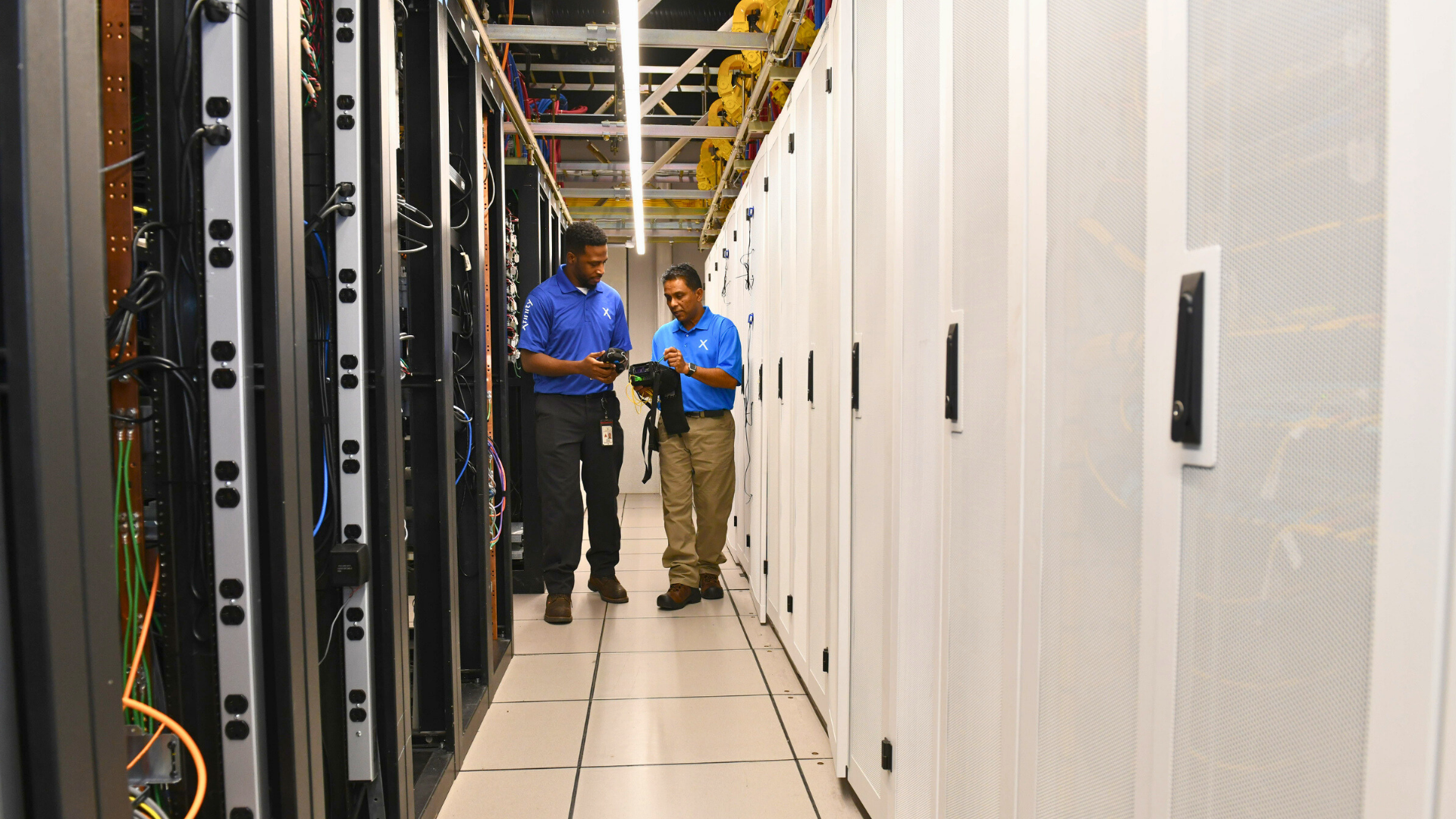 Network technicians in a Comcast headend.