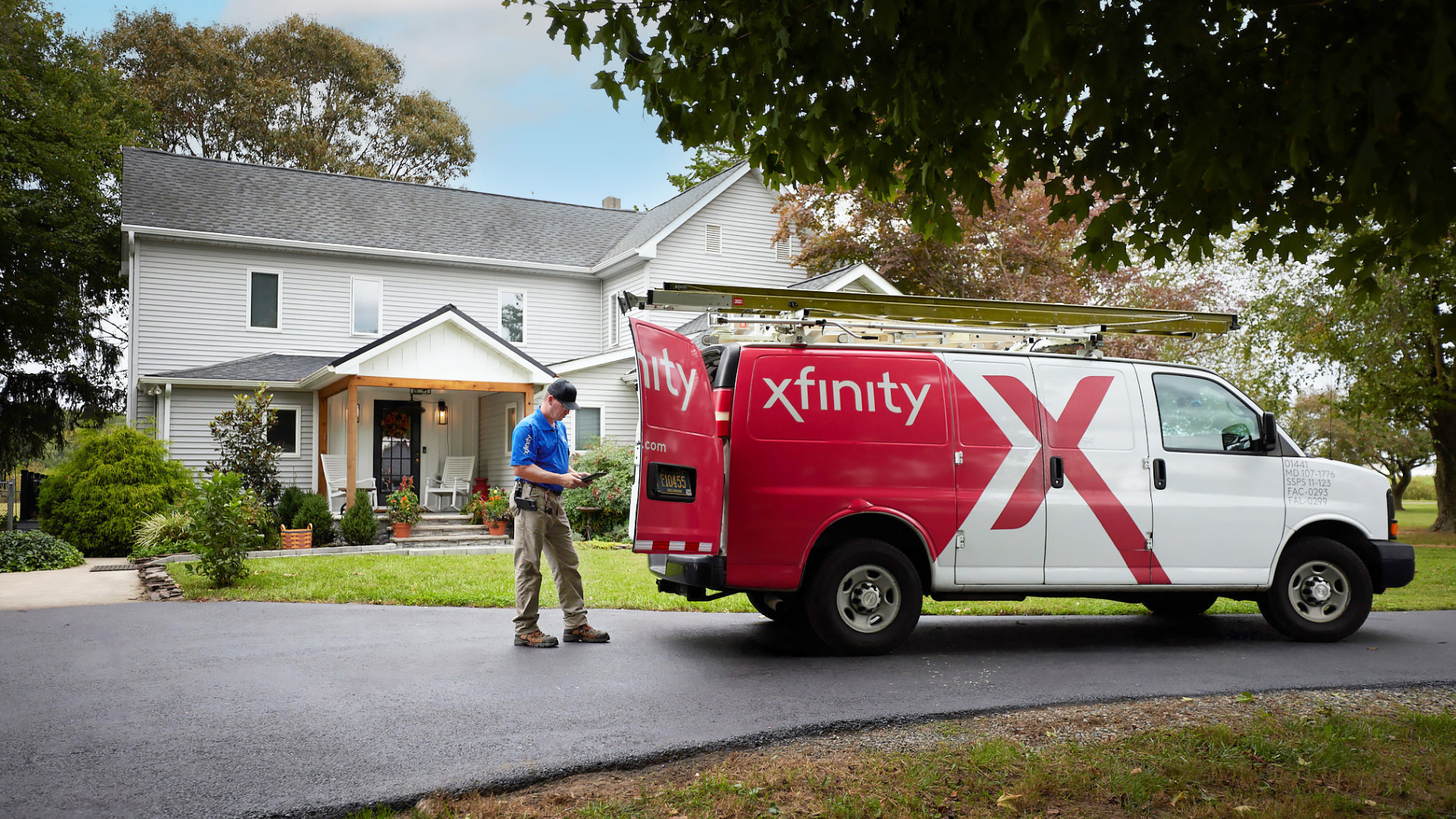Xfinity Technician outside of residential home.